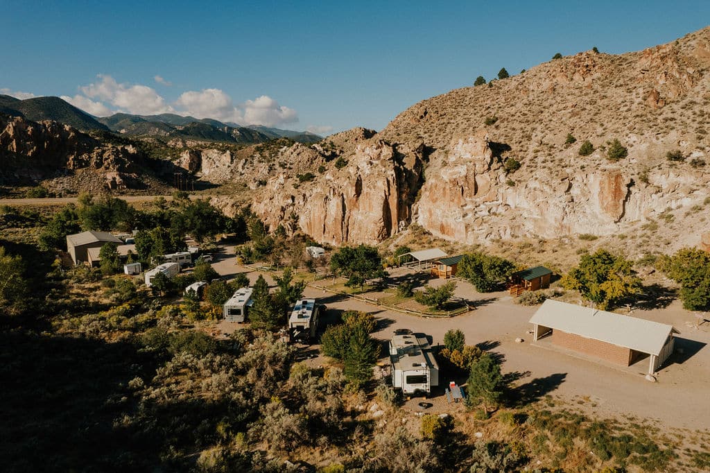 a group of rvs parked in a desert